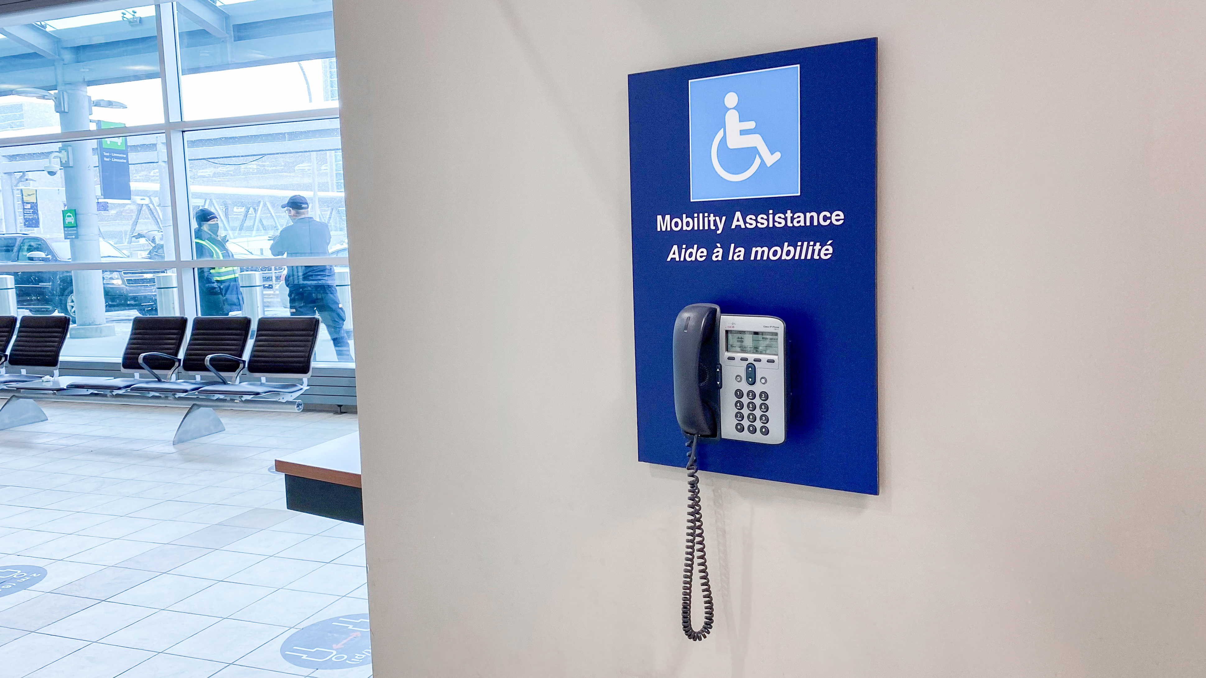 Photo of a mobility assistance phone that is available in the airport terminal.