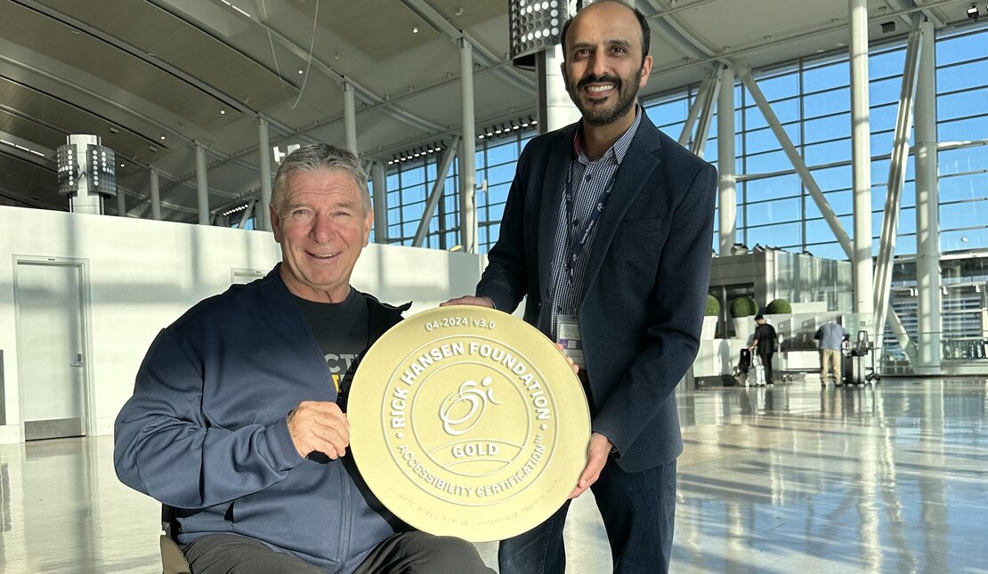 Rick and Kurush hold the RHFAC gold certification plaque 