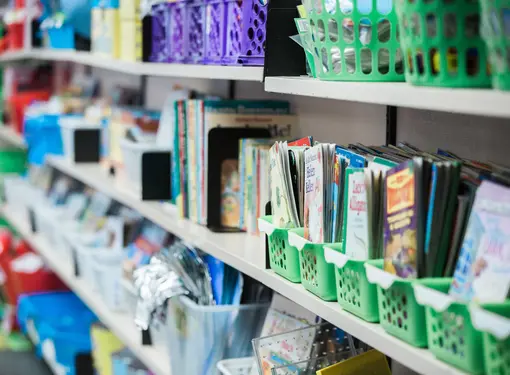 books on a shelf in a classroom