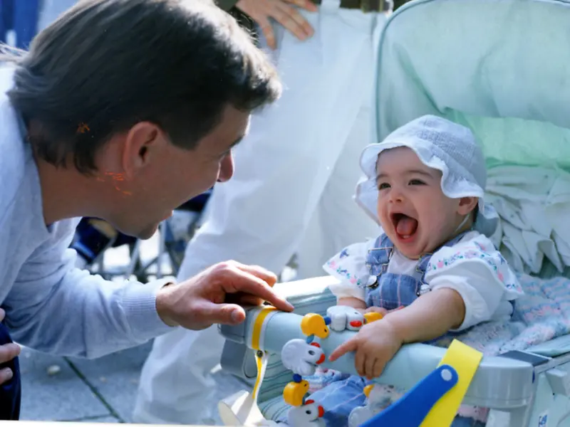 Rick Hansen interacting with his baby daughter.