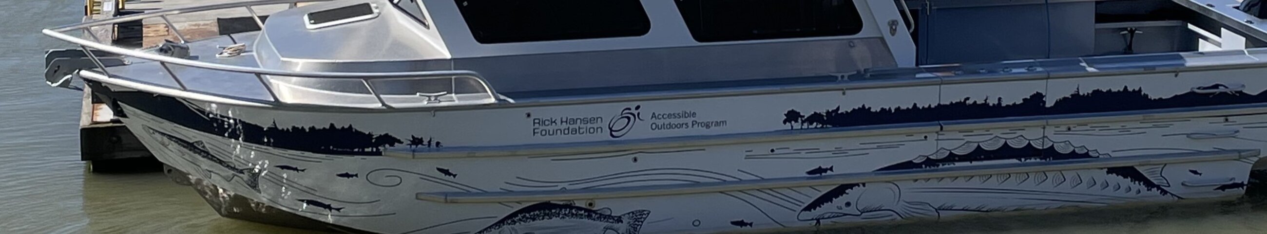 Boat with the text Rick Hansen Foundation Accessible Outdoors Program 