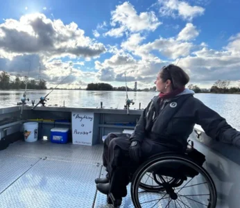 Woman in a wheelchair looking at the water