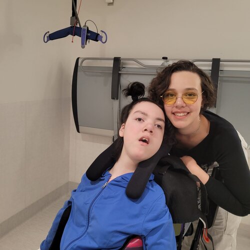 Two women beside an accessible lift